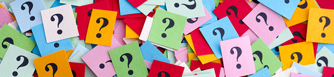 Multi-colored paper question marks